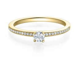 brillant  solitar mit seitlichem besatz kanal gelbgold